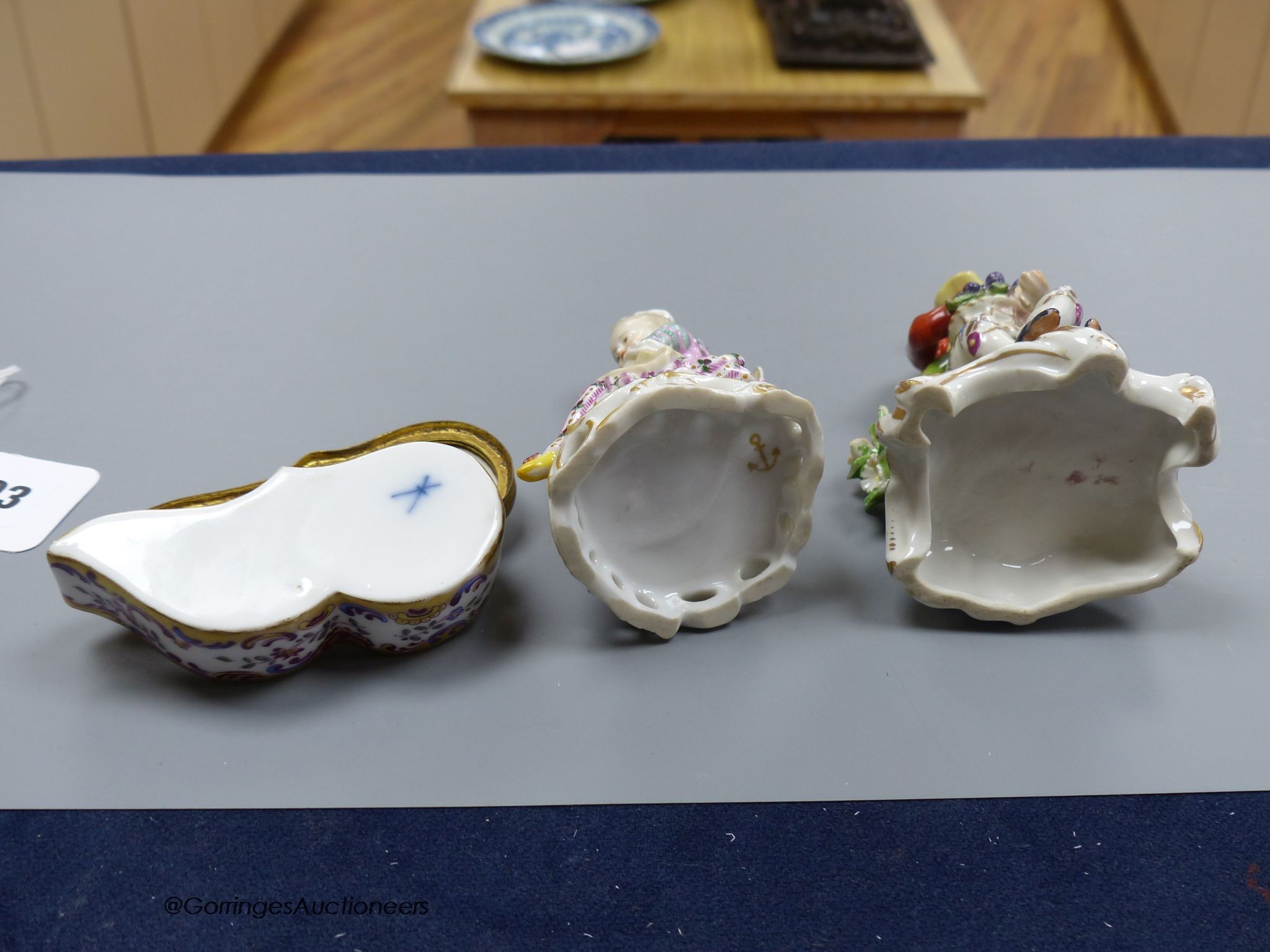 Two Chelsea style porcelain figures, tallest 13cm, and a Meissen style porcelain box